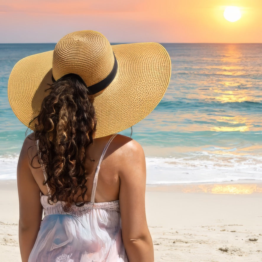 model on beach wearing damazo beige soleil flow hat