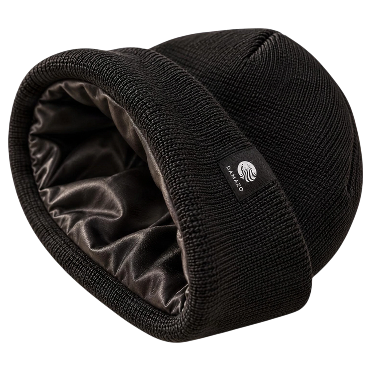 Black NYX Oversized silk-lined beanie on its side, showing the silk lining