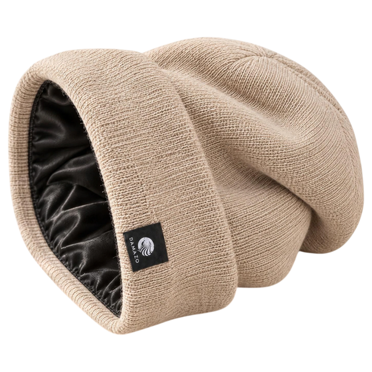 Cream NYX Oversized silk-lined beanie on its side, showing the black silk lining