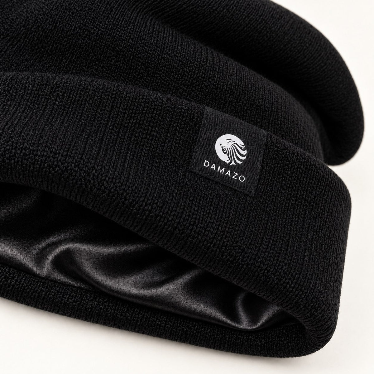 Black oversized silk-lined wool beanie, label and silk lining detail