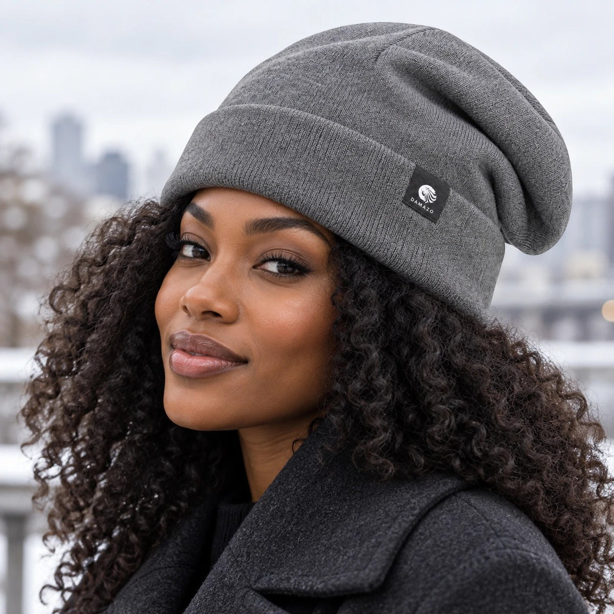 Grey NYX Oversized silk-lined wool beanie, worn over curly hair